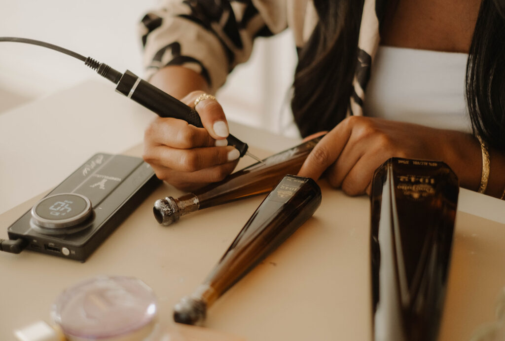 Hand-engraved calligraphy on Don Julio tequila bottles, featuring personalized lettering etched into glass for a luxury, custom finish